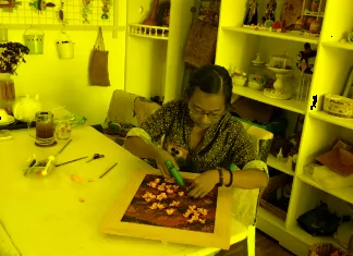 The Girl Makes Clay Blossom