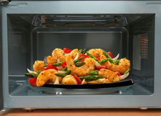 What happens if you stand near a working microwave? Why?