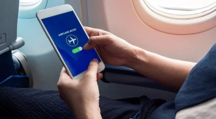 Why should you turn off your phone when on an airplane?