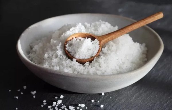 What is the purpose of placing a bowl of salt in the corner of the house?
