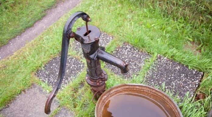 Why do well water or borehole water often have a yellow color?