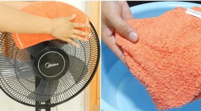 What is the effect of placing a wet towel on a fan?