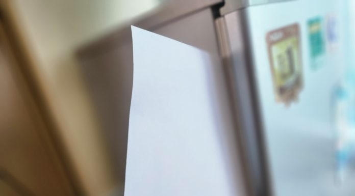 Tips for checking if your refrigerator is using too much electricity with a piece of paper