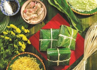 Traditional square bánh chưng wrapping technique for Tet