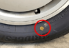 The significance of yellow and red dots on car tires.