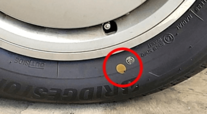 The significance of yellow and red dots on car tires.
