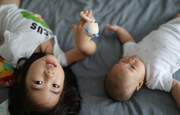 The difference between having one child and having two, the sooner the better