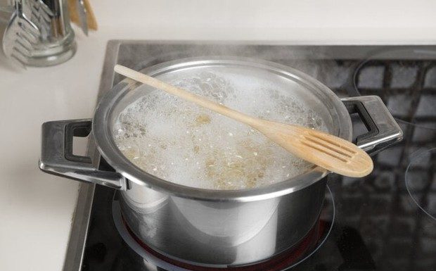 What Does Placing a Wooden Spoon Across a Boiling Pot Do?