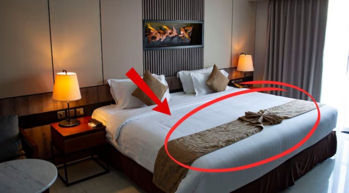 Why do hotel beds usually have a horizontal bedspread? Is it just for decoration?