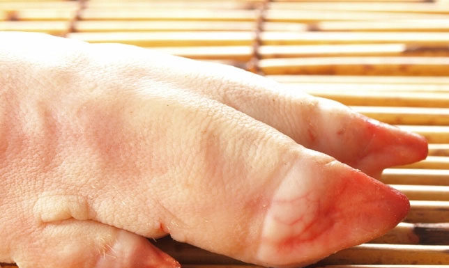 Should I choose the front or back leg when buying pork shank?