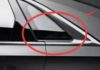 What is the purpose of the fixed triangular glass window frame on the side of a car?