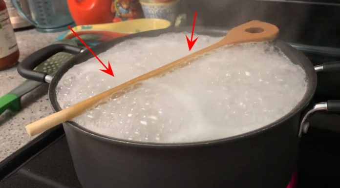 Why should you place a wooden lid on the pot while cooking?