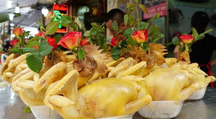 Why do roosters always hold a rose on New Year’s Eve? Can they hold a chrysanthemum or orchid?