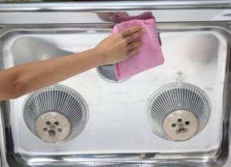 Clean your greasy kitchen range hood without removing it with this handy trick