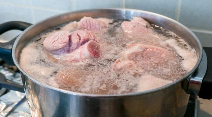 Why does bone broth often froth when cooking?