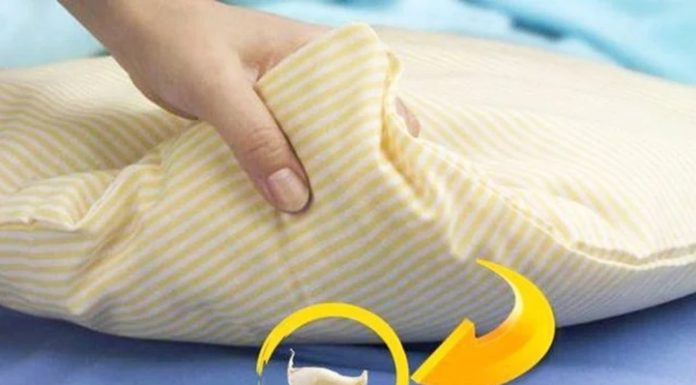 What are the benefits of placing garlic under the pillow while sleeping?