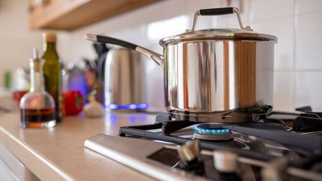 Why you should not place a freshly washed pan directly on a gas stove?