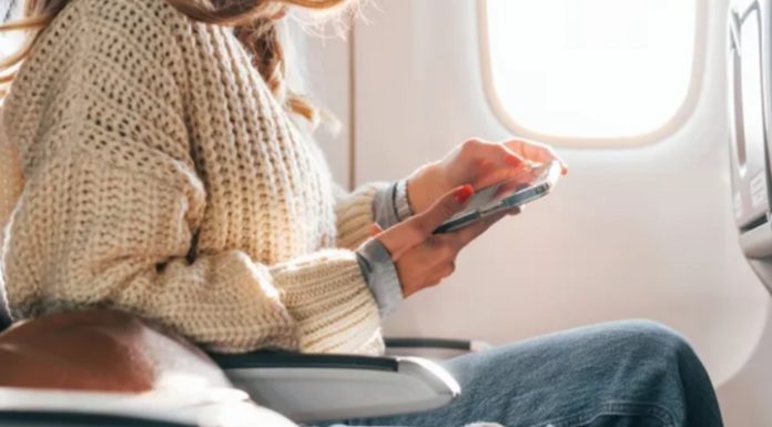 Why should you wear loose-fitting jeans on an airplane?