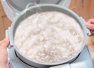 What causes an electric rice cooker to remain uncooked?