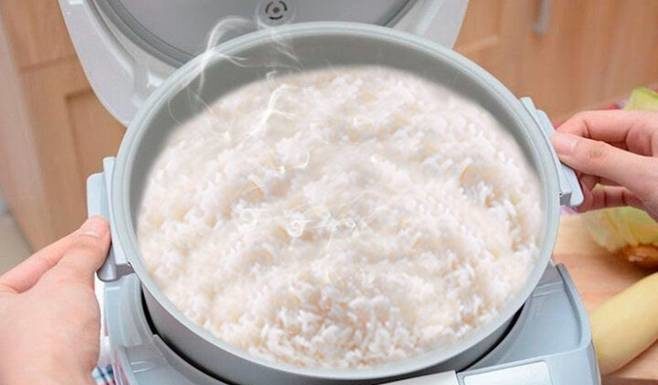 What causes an electric rice cooker to remain uncooked?
