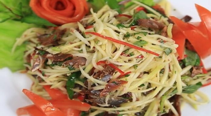 The Golden Delight: A Tropical Salad Extravaganza with Crispy, Golden-Fried Fish.