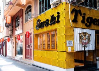 The Ultimate Sushi Experience: Standing Up in the Heart of District 1