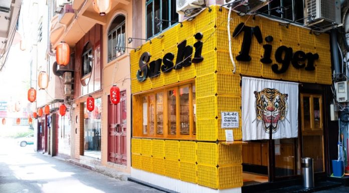 The Ultimate Sushi Experience: Standing Up in the Heart of District 1