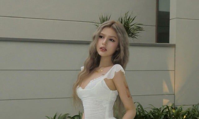 The Perfectly Ripe Mango: Captivating Audiences with Her White Dress Ensemble