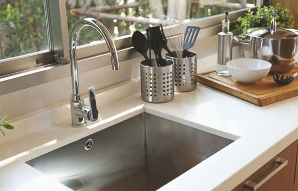 What is the Purpose of the Circular Hole Next to the Kitchen Sink?