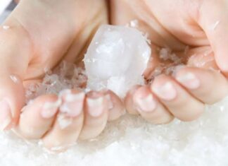 Why Do Ice Cubes from the Freezer Stick to My Hand?