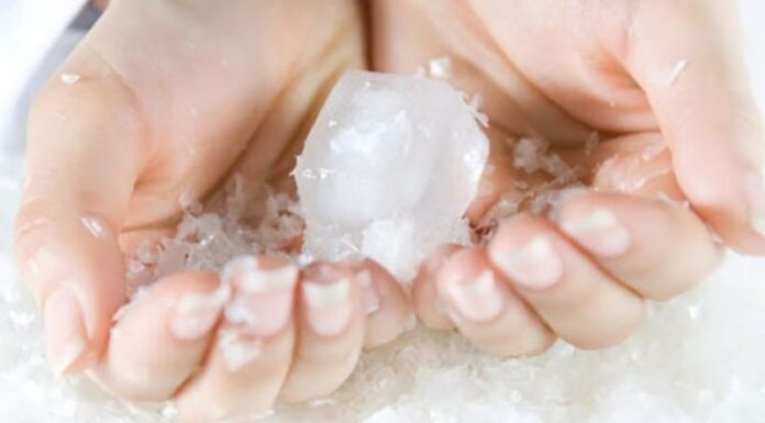 Why Do Ice Cubes from the Freezer Stick to My Hand?