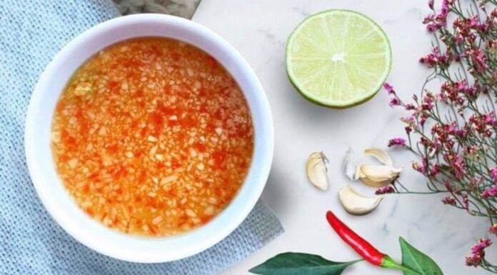 The Perfect Dipping Sauce: A Tasty Blend with Floating Chilli and Garlic Goodness