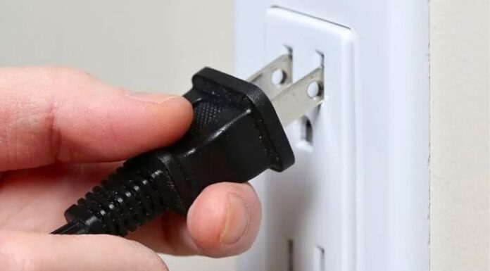 Why Do Flat Electrical Plugs Have Two Round Holes? The Reason is Amazing.