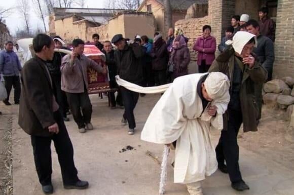 The Ancient Wisdom: ‘Rain on a Coffin Brings a Lifetime of Misery, but Rain on a Grave Ensures Eternal Wealth’