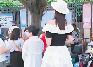 The Mom in a Mini Skirt Picking Up Her Child: Embracing Two Stylish Approaches That Make Moms the Apple of Their Children’s Eyes.