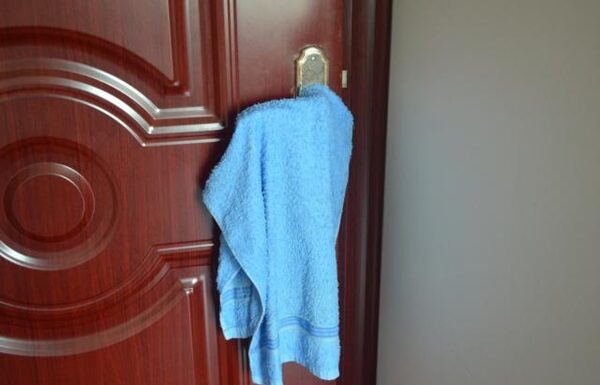 Why Do People Hang Towels on Door Handles in Hotels? This Hack is Genius.