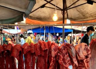 Why Do Butchers Hang Beef Up High, While Pork Is Placed on Tables?